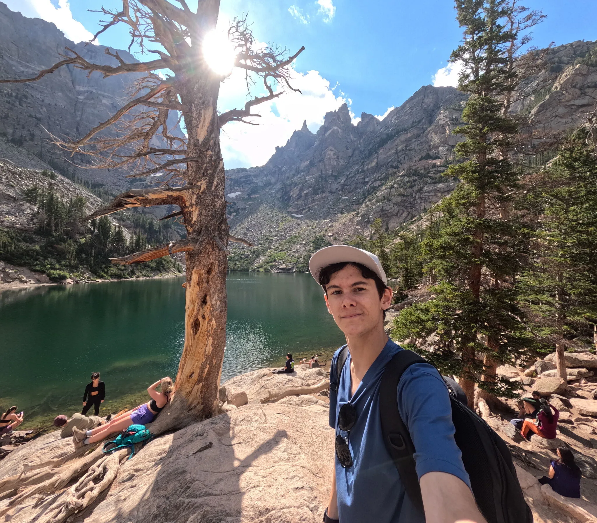 TJ beside an alpine lake in the American West