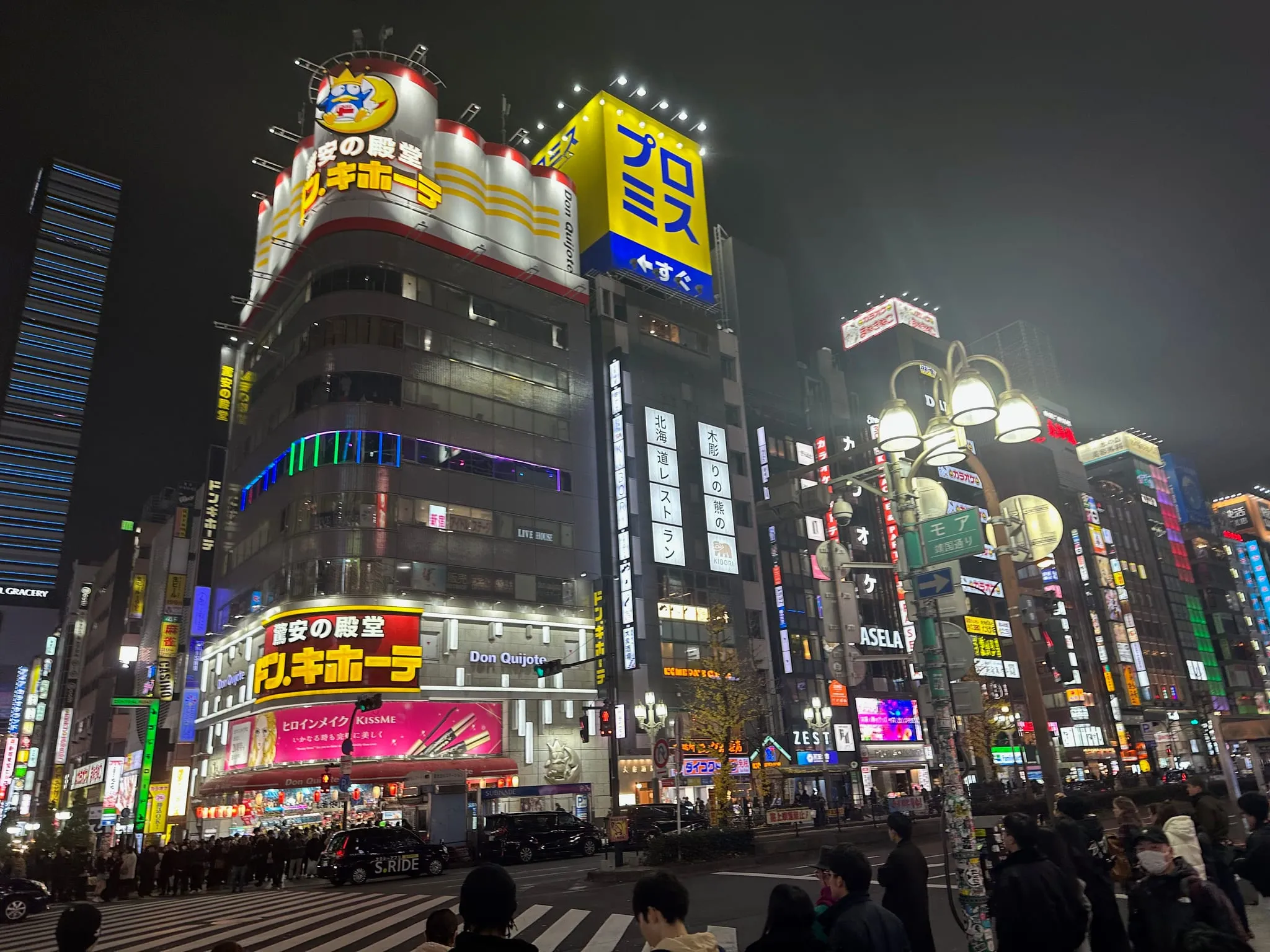 Neon signs on buildings in Shinjuku at night