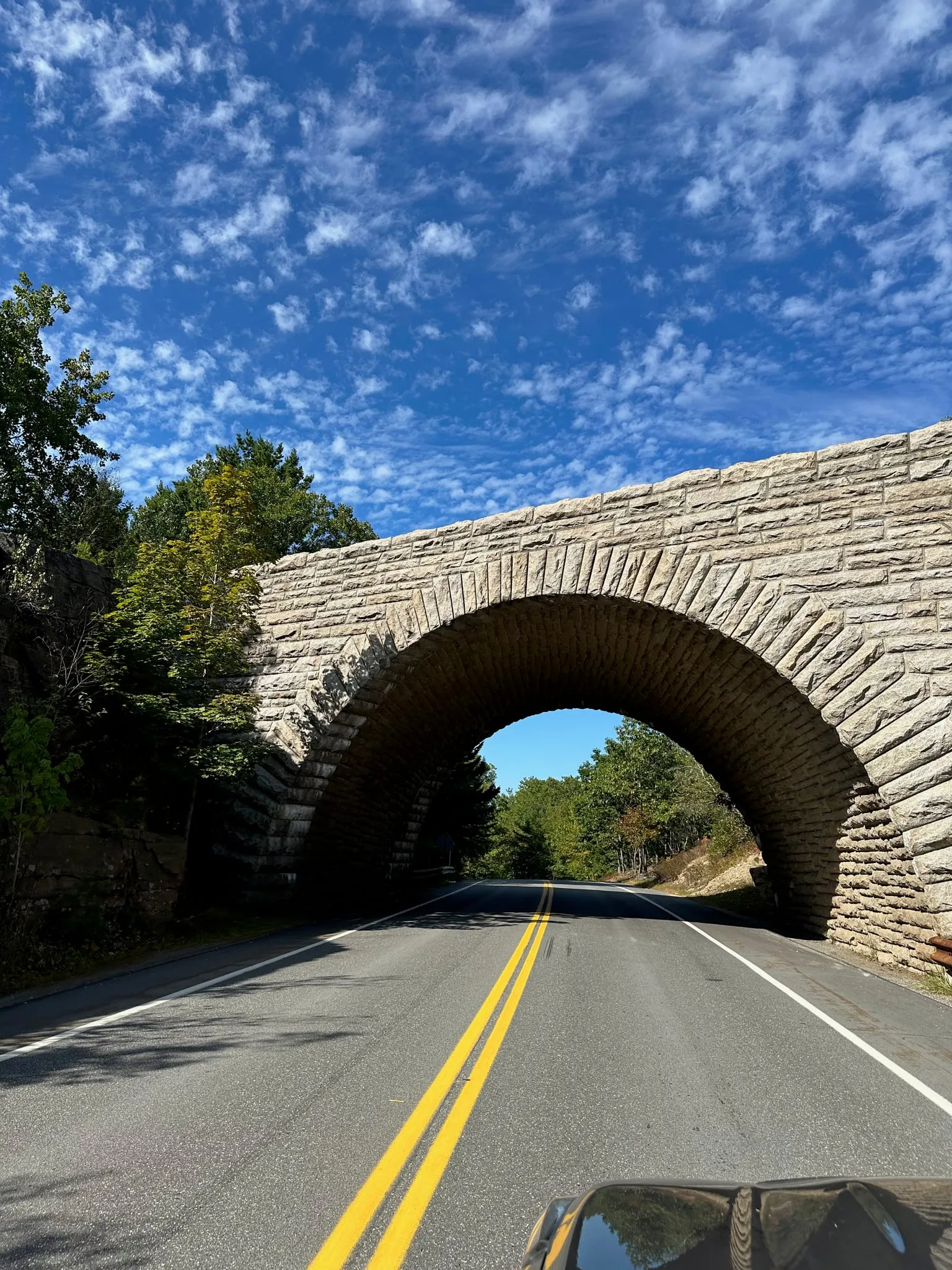 A stone bridge over the road in Acadia