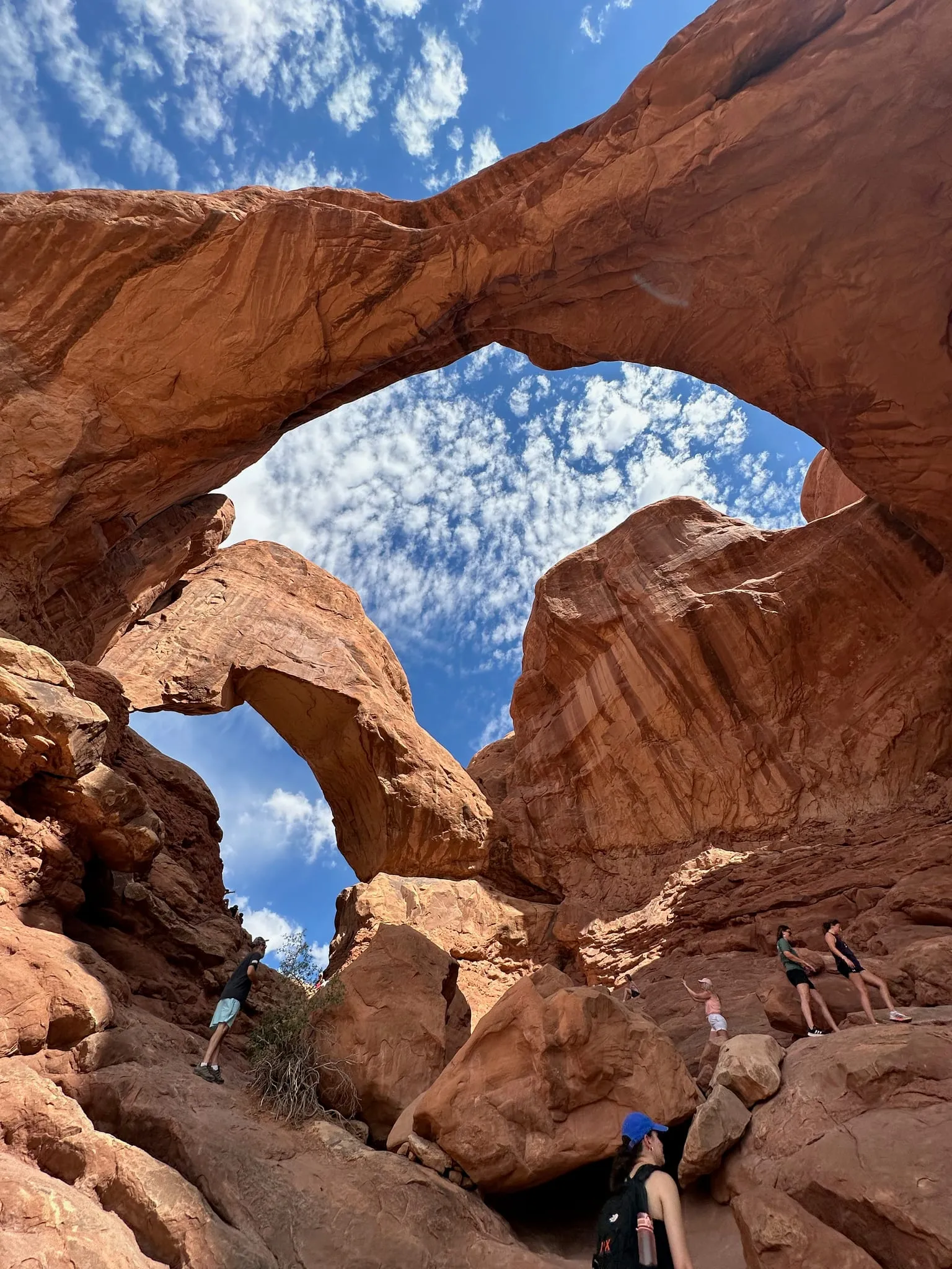 Looking up through Double Arch at a cloudy sky