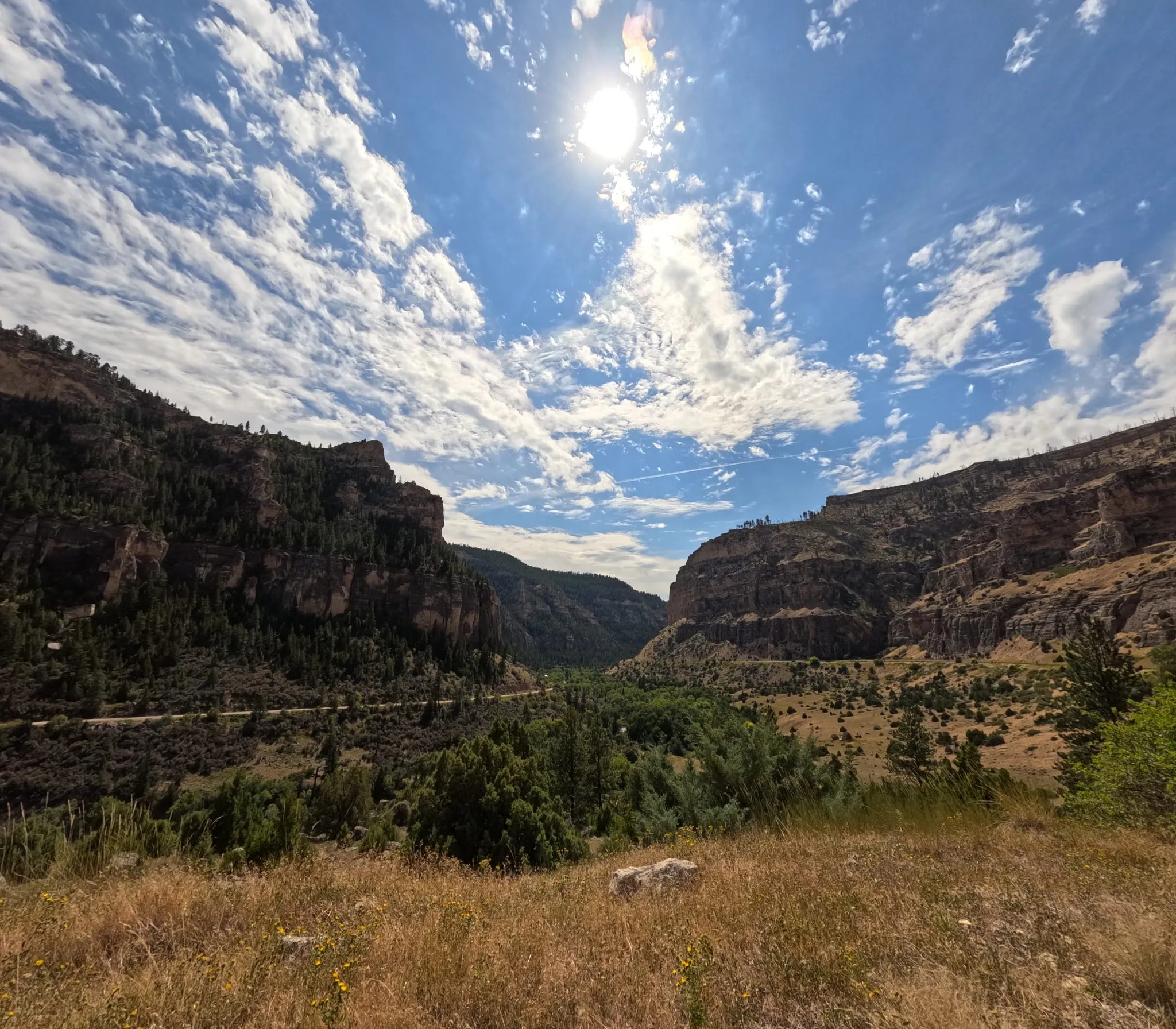 A wide canyon under a bright sky