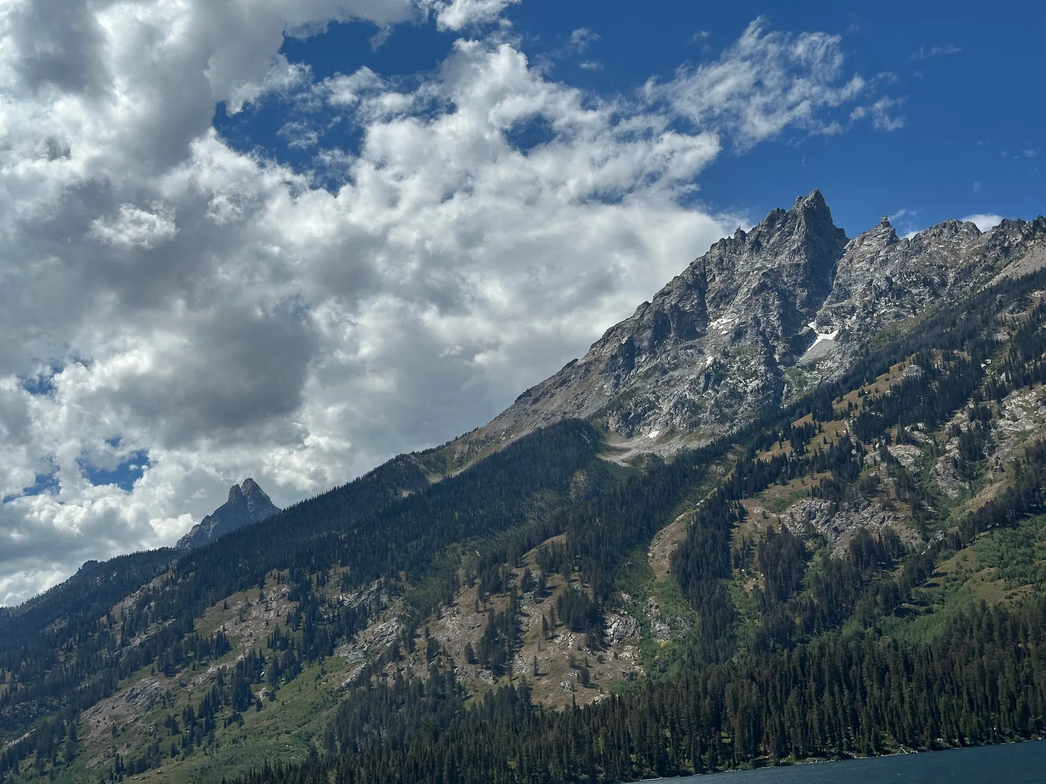 A jagged ridge under big clouds in Grand Teton