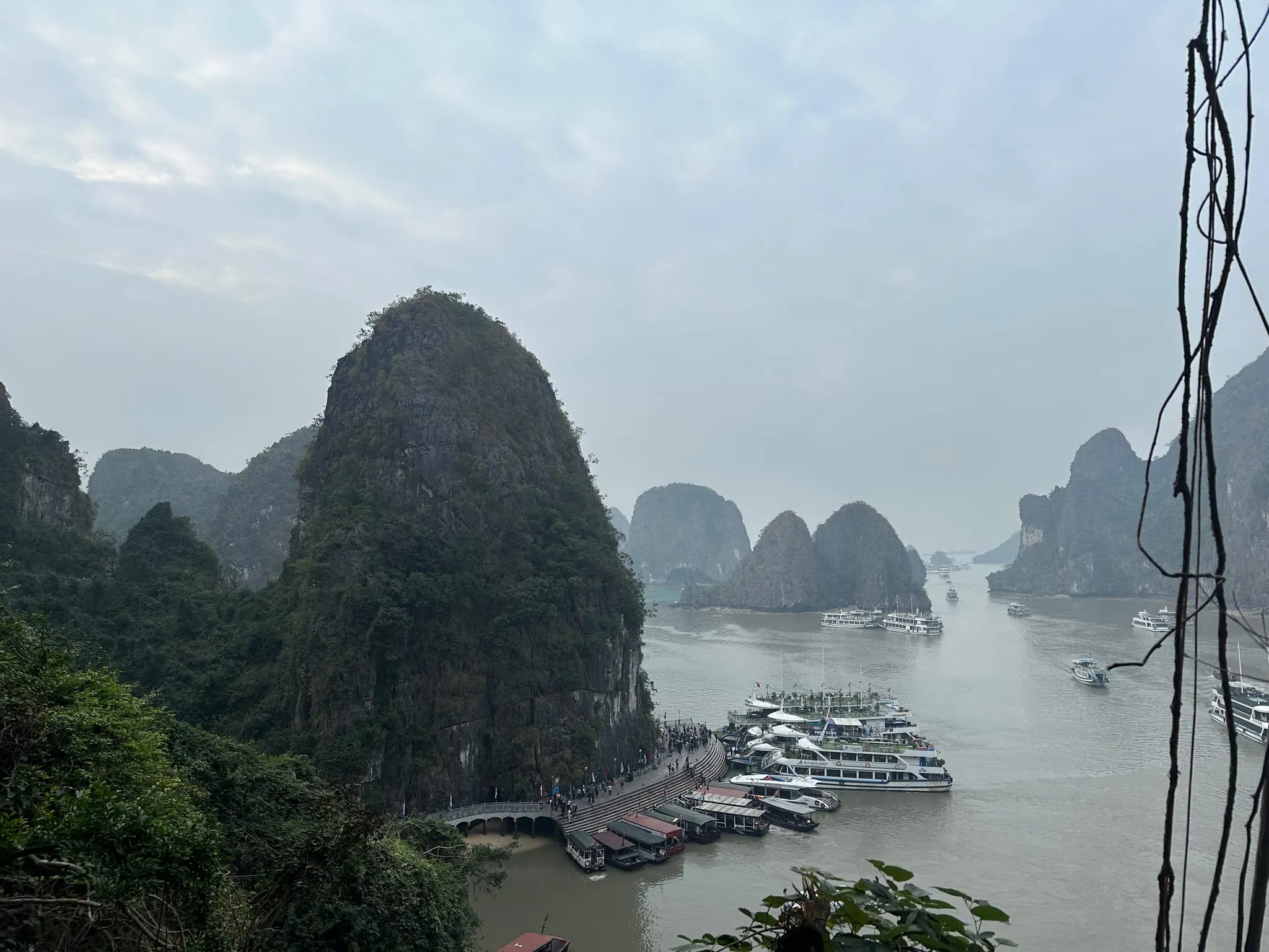 Limestone islands and docked boats in Ha Long Bay